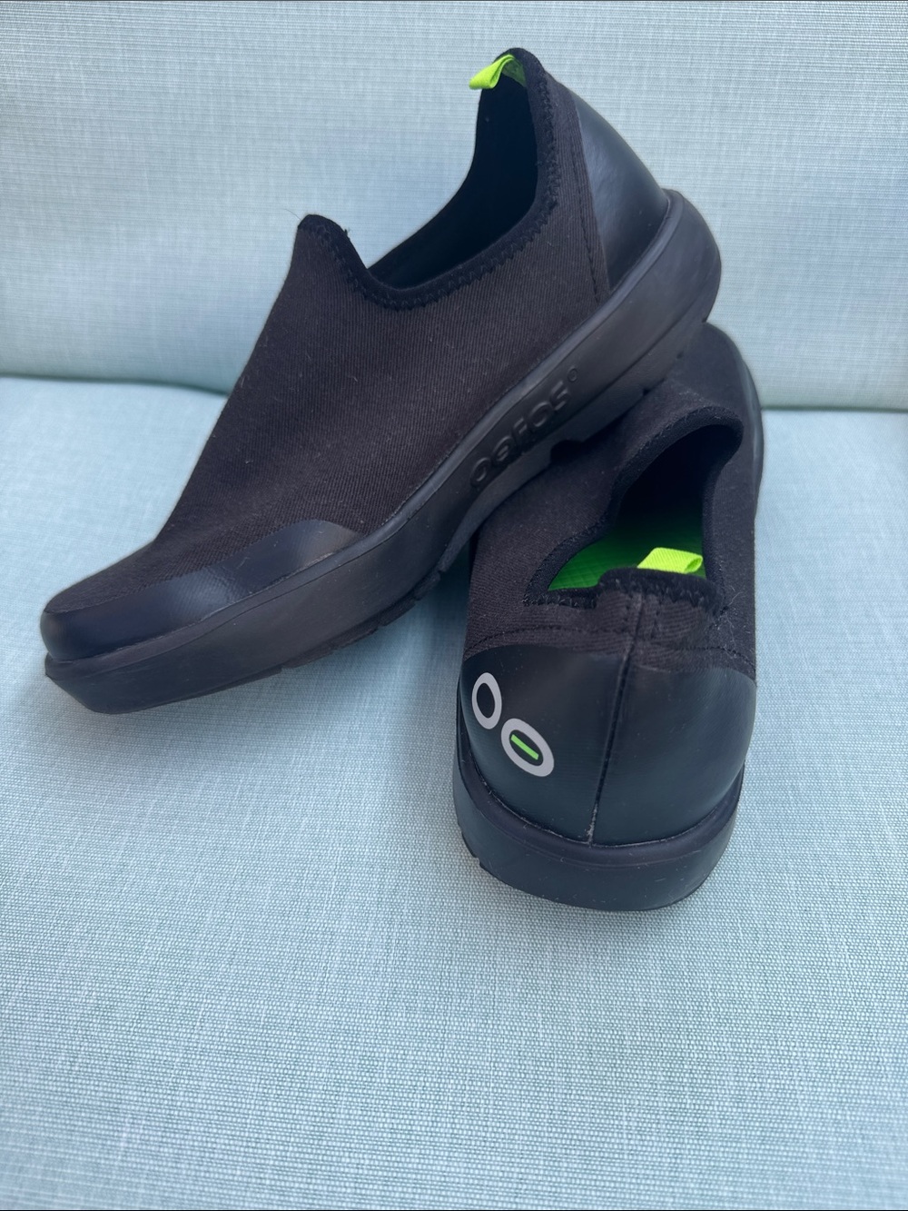 Oofos Women’s Black Slip-On Recovery Shoe with Lime Green Insole